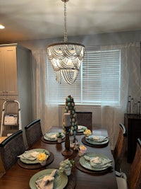 a dining room with a table and chairs